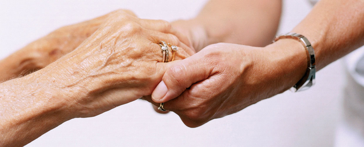 A Caring Nurse Holds A Senior Hands - In Home Help For The Elderly - ESP Healthcare