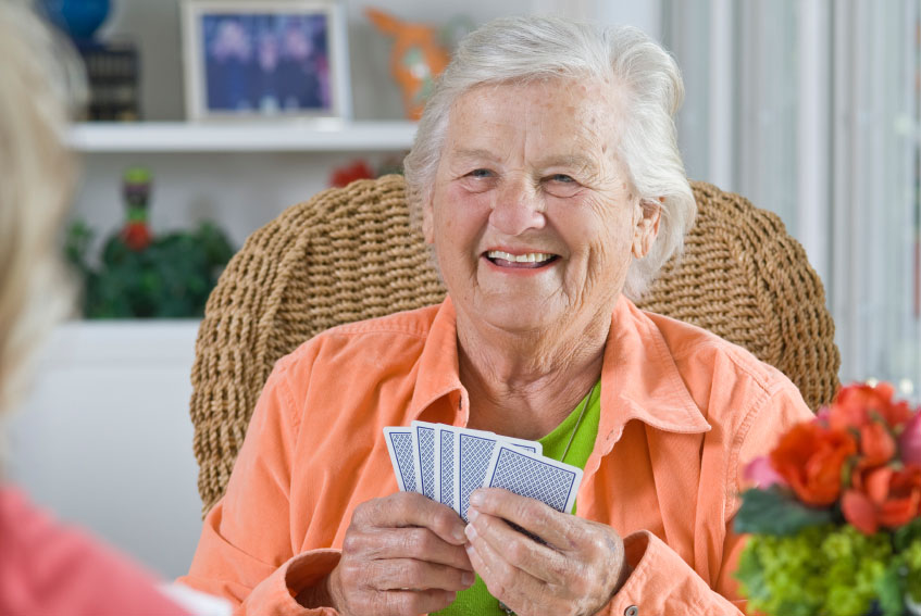 A Senior Lady Playing Cards - Home Care Package Provider - ESP Healthcare