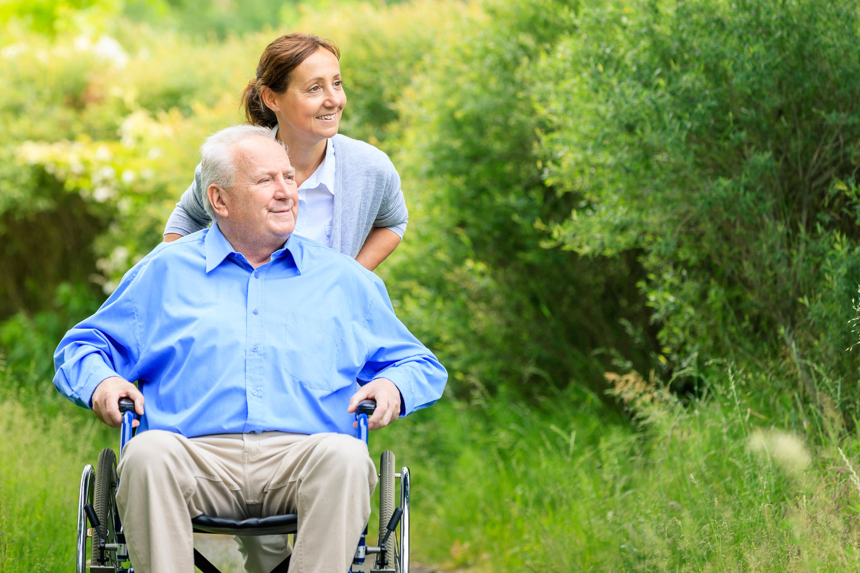 A Female Nurse Pushing An Old Man In Wheelchair - In Home Care Sydney - ESP Healthcare